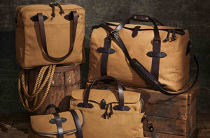 Choose Wisely With Filson’s Indiana Jones-Themed Luggage & Apparel